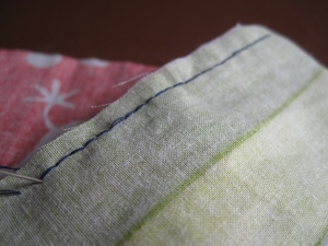 The smooth neat side of the backstitch seam
